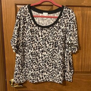 Chic Leopard Print Blouse with Black Trim